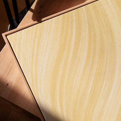 Flowing honey gold waves with soft warm glow, canvas print in a warm, minimally styled interior