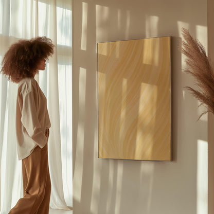 Flowing honey gold waves with soft warm glow, canvas print presented in a light, minimal room