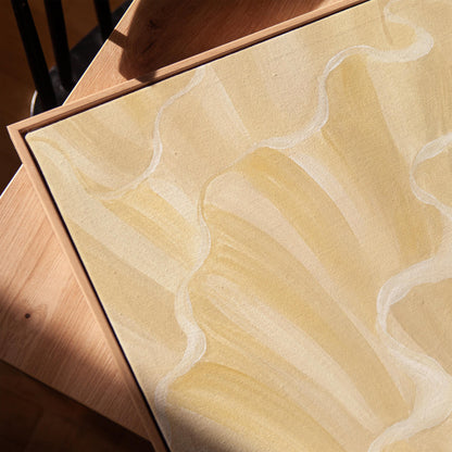 Ruffled wave folds in champagne cream and gold, canvas print in a warm, minimally styled interior