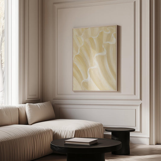 Ruffled wave folds in champagne cream and gold, canvas print hanging in a calm, modern living space