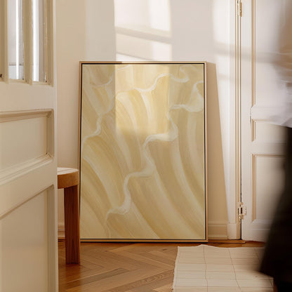 Ruffled wave folds in champagne cream and gold, canvas print styled against a soft white wall