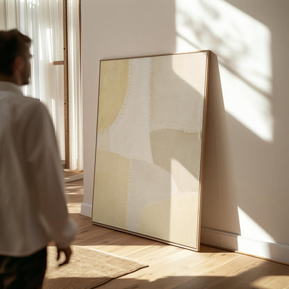 Soft tonal beige blocks joined by delicate stitch lines, canvas print seen in a warm interior with natural light