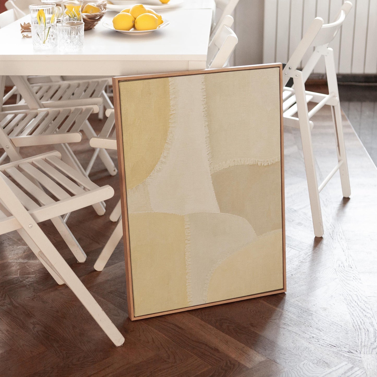 Soft tonal beige blocks joined by delicate stitch lines, canvas print presented in a light, minimal room