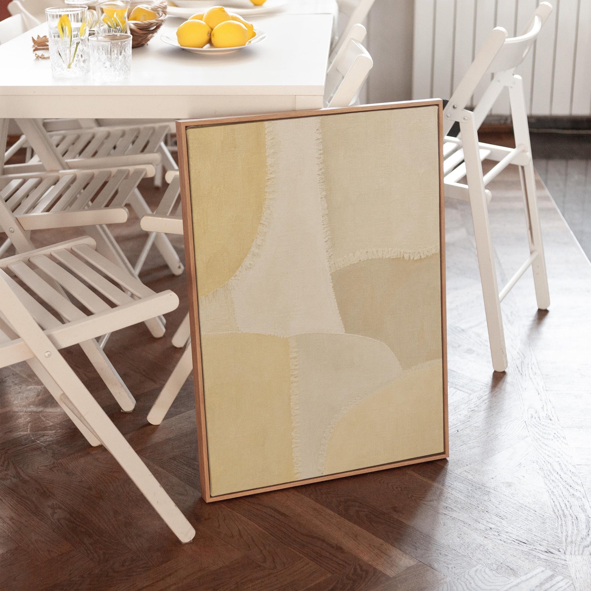 Soft tonal beige blocks joined by delicate stitch lines, canvas print presented in a light, minimal room