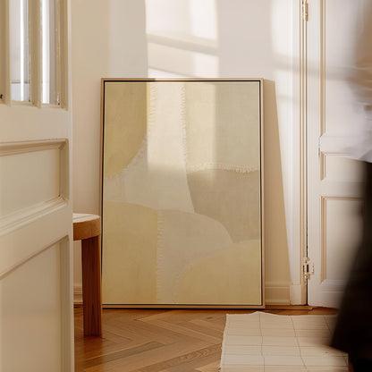 Soft tonal beige blocks joined by delicate stitch lines, canvas wall art on a quiet wall in a considered interior