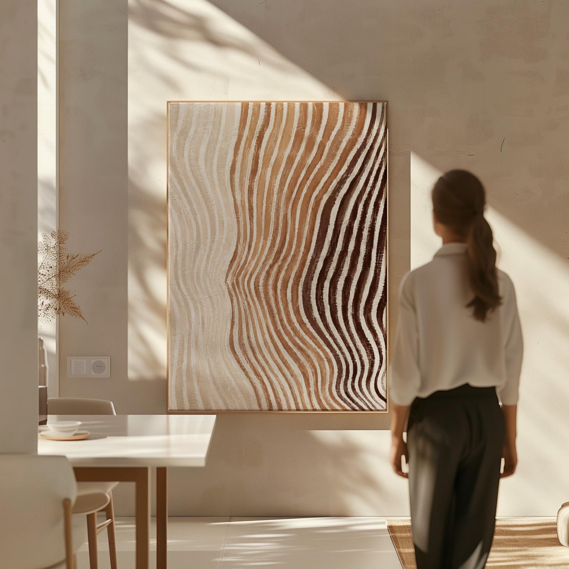 Rippling contour lines in cocoa brown and cream, canvas print displayed on a neutral wall in a styled interior