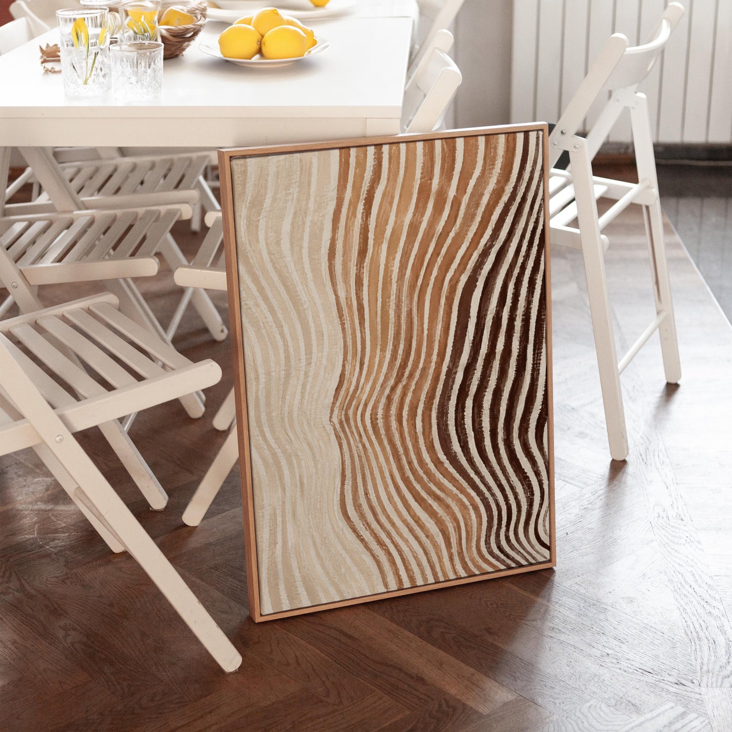 Rippling contour lines in cocoa brown and cream, canvas wall art seen in a warm interior with natural light