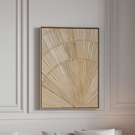 Golden fan palm leaf with radiating rays on cream, canvas print in a bright room with natural daylight