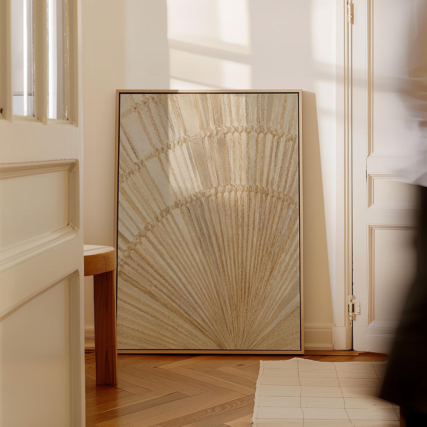 Golden fan palm leaf with radiating rays on cream, canvas print presented in a light, minimal room