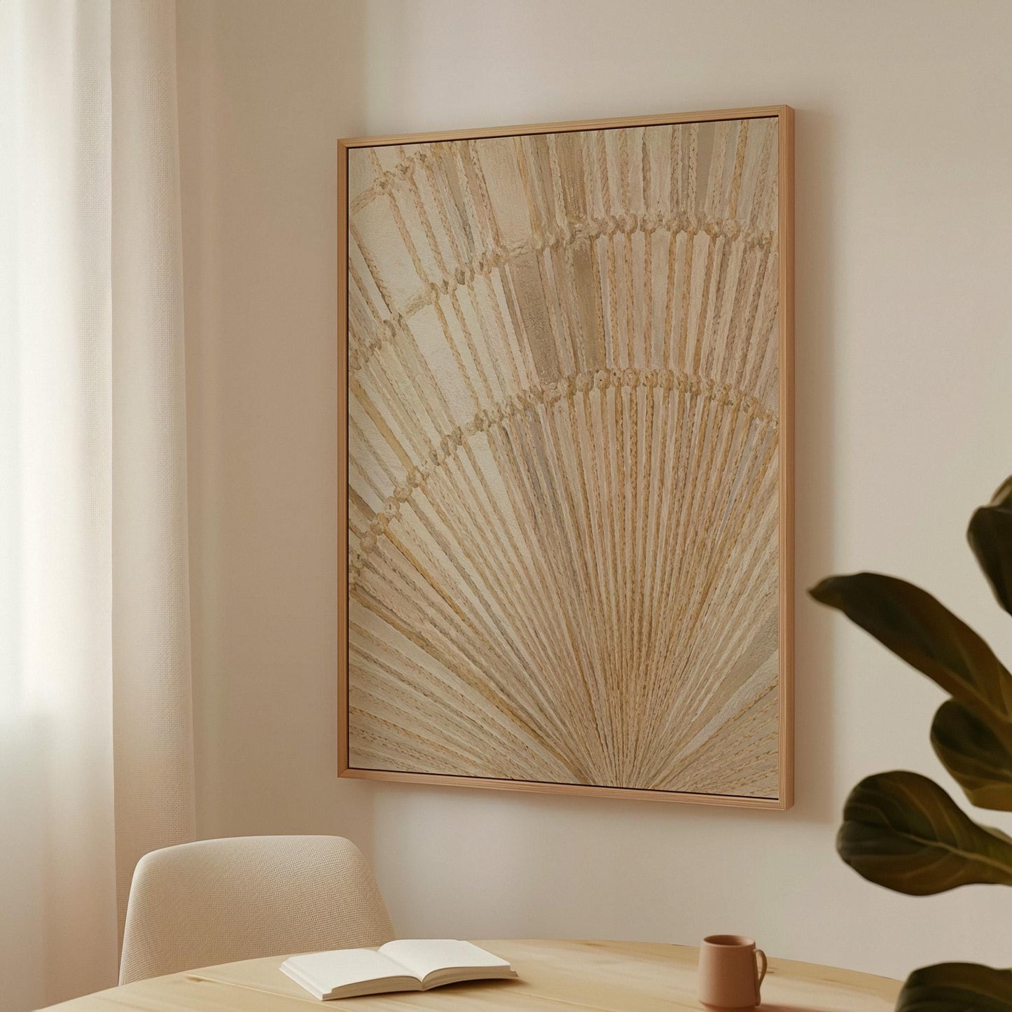 Golden fan palm leaf with radiating rays on cream, canvas wall art hanging in a calm, modern living space