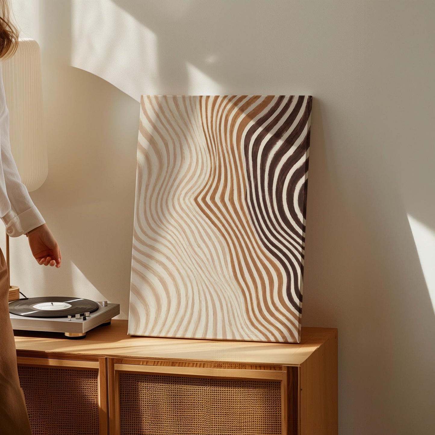 Wavy line pattern fading from beige to rust and brown, canvas print shown in a sunlit, contemporary room