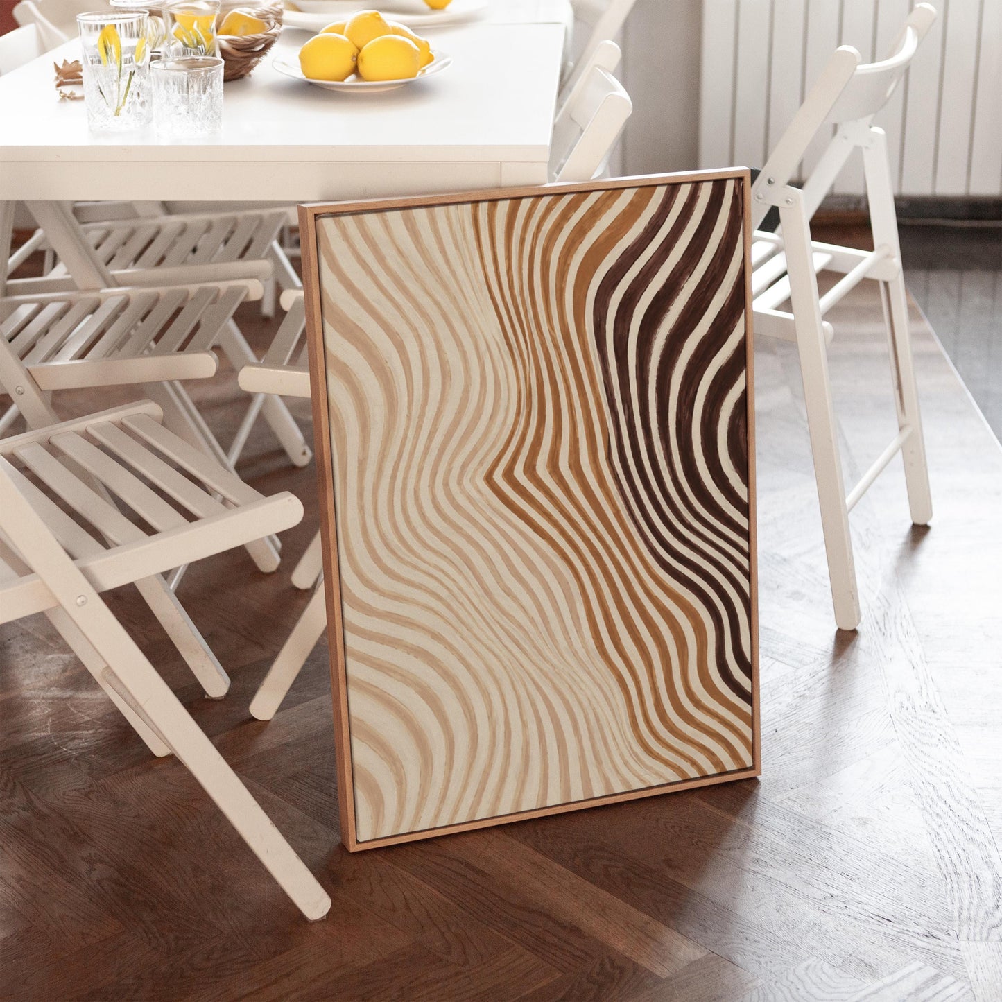 Wavy line pattern fading from beige to rust and brown, canvas wall art hanging in a calm, modern living space