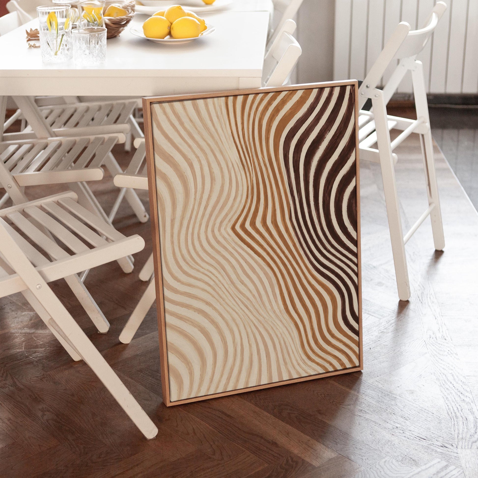 Wavy line pattern fading from beige to rust and brown, canvas wall art hanging in a calm, modern living space