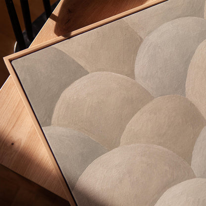 Rows of soft dome shapes in stone gray and beige, canvas print in a warm, minimally styled interior