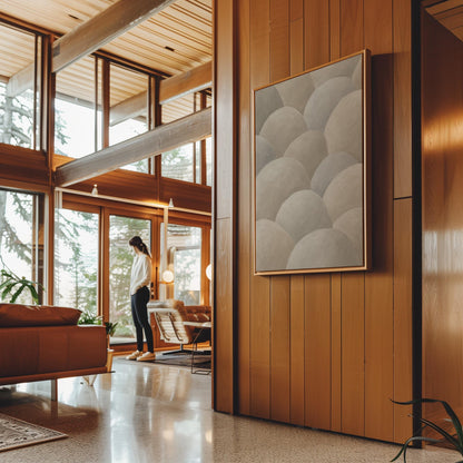 Rows of soft dome shapes in stone gray and beige, canvas print presented in a light, minimal room