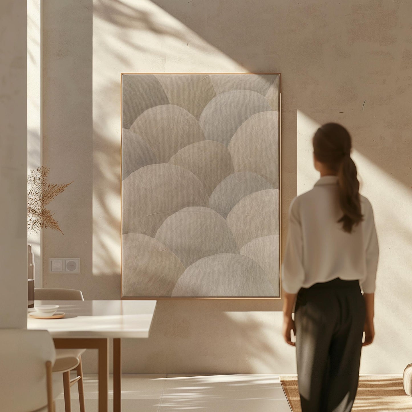Rows of soft dome shapes in stone gray and beige, canvas print shown to scale in a furnished room