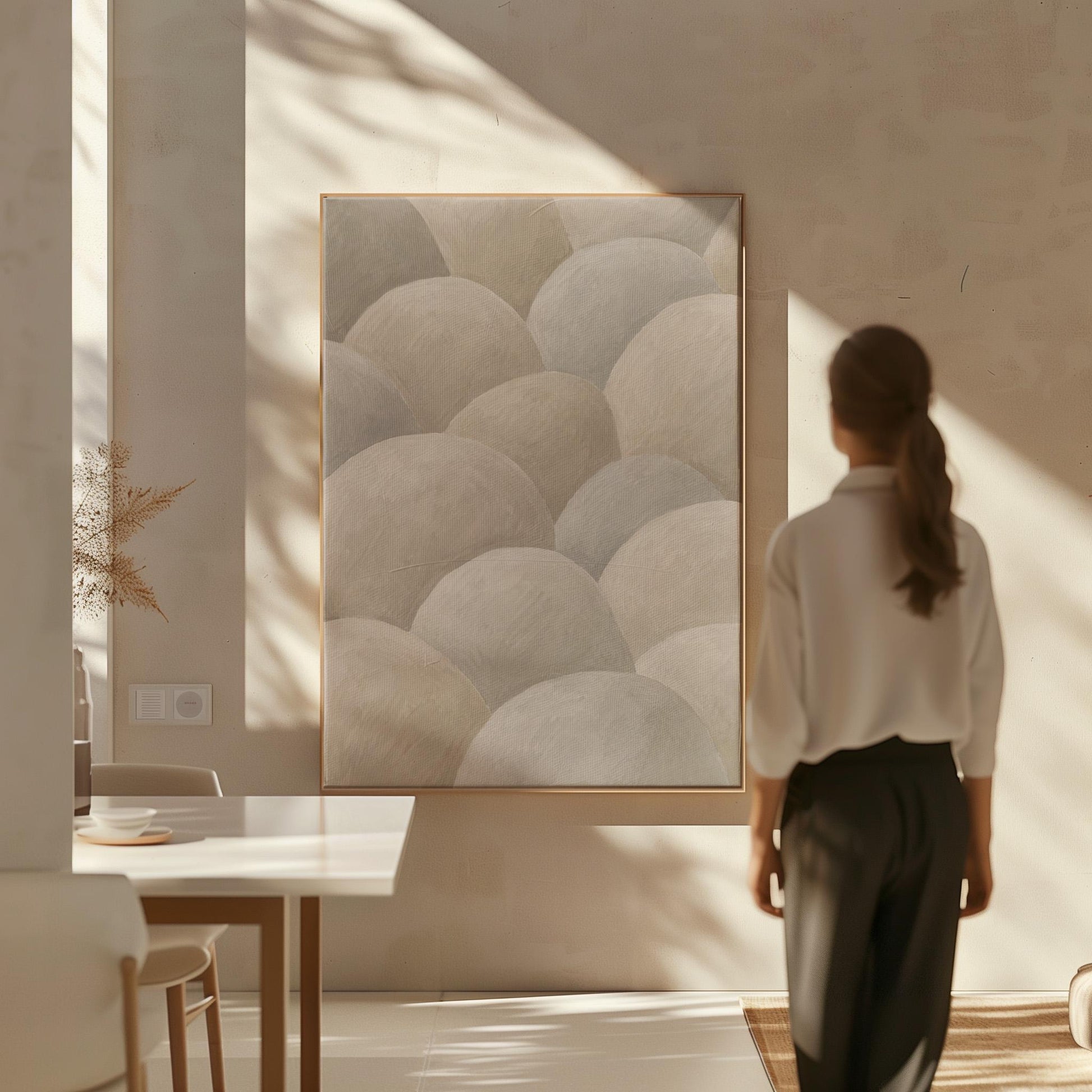 Rows of soft dome shapes in stone gray and beige, canvas print shown to scale in a furnished room