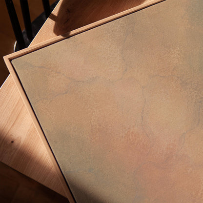 Hazy gradient blending peach and sage tones, canvas print in a warm, minimally styled interior