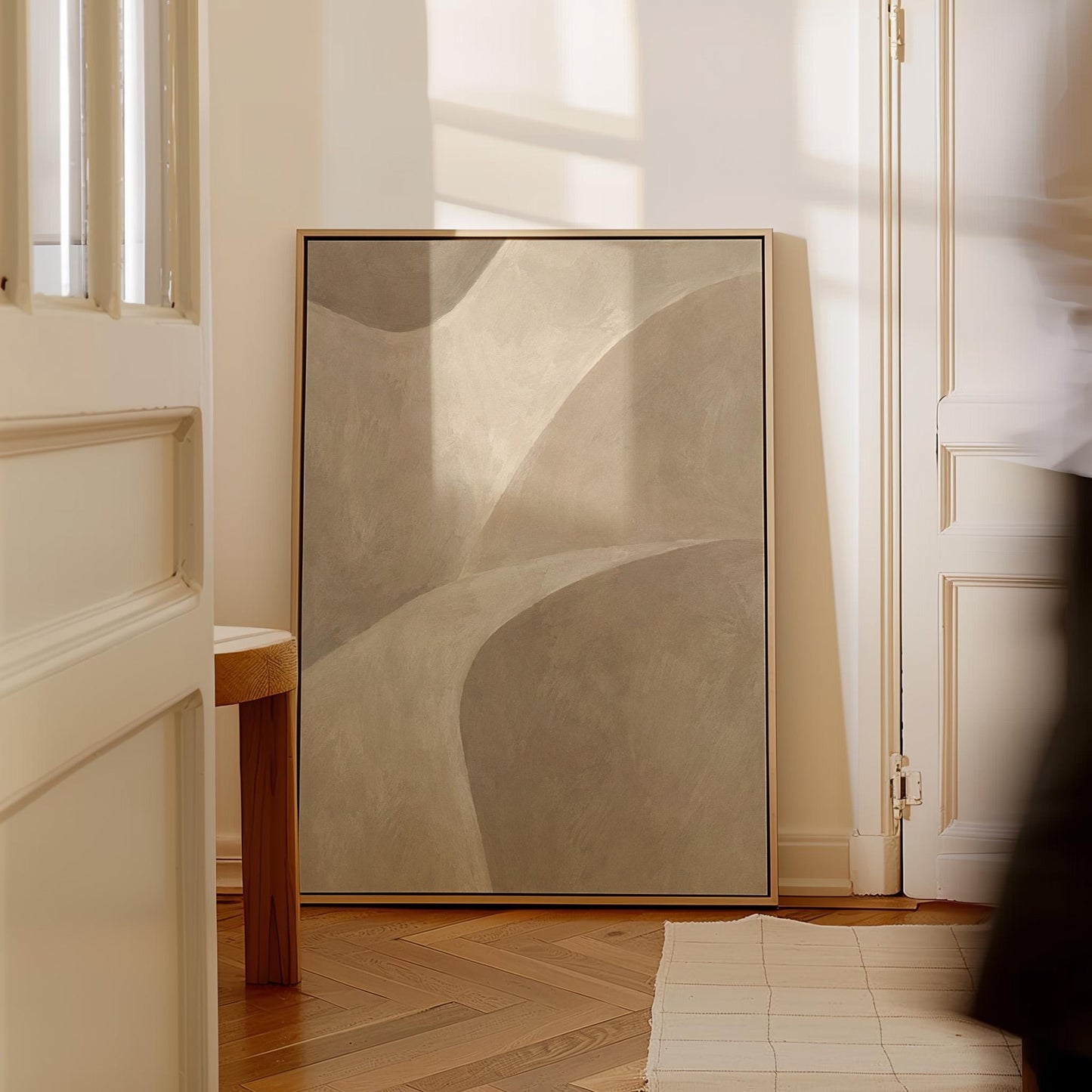 Minimal soft curved lines crossing taupe field, canvas print shown in a sunlit, contemporary room