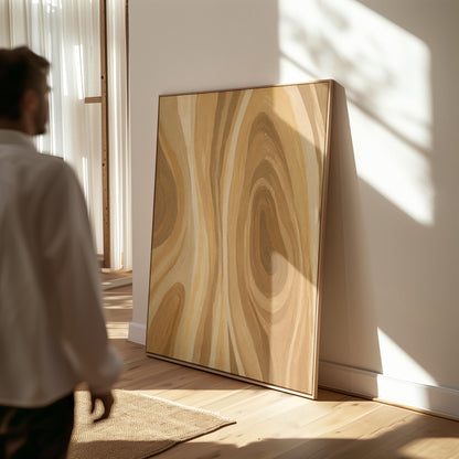 Concentric swirling lines in amber and caramel, canvas print on a quiet wall in a considered interior
