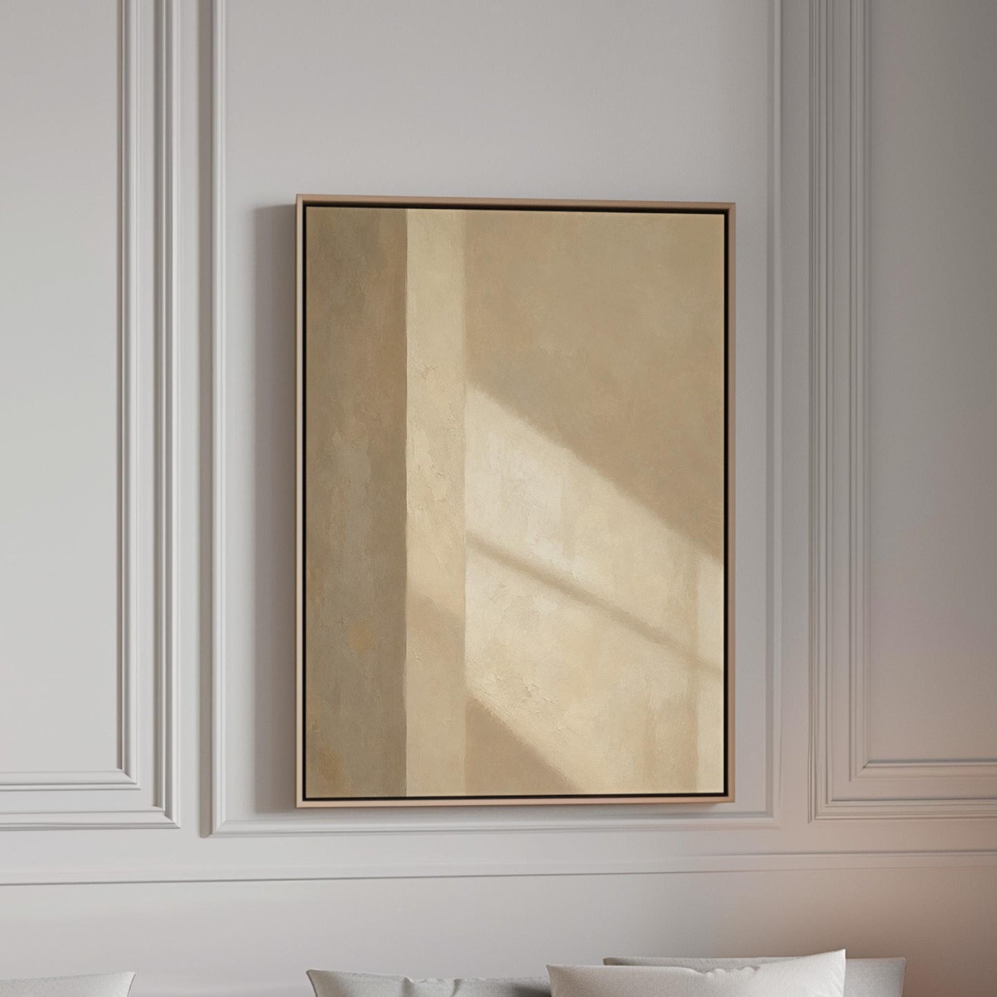 Vertical bands of light and shadow on warm beige, canvas print in a bright room with natural daylight