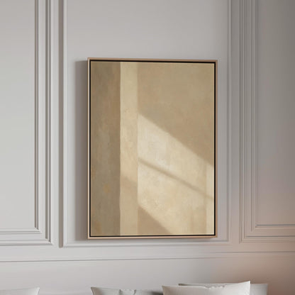 Vertical bands of light and shadow on warm beige, canvas print in a bright room with natural daylight