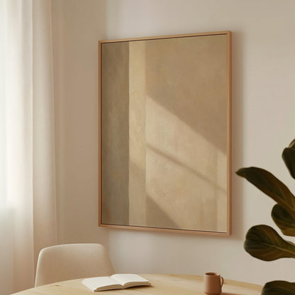Vertical bands of light and shadow on warm beige, canvas wall art seen in a warm interior with natural light