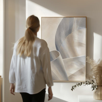 Graceful ribbon curves in silver and pale blue, canvas wall art on a quiet wall in a considered interior