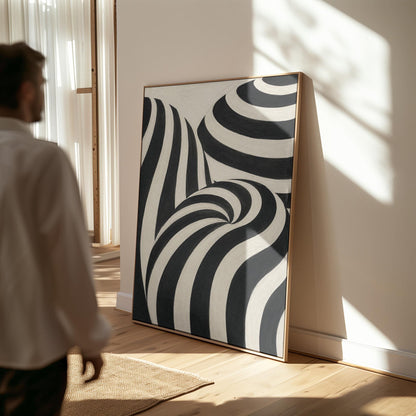 Swirling black and white striped forms, canvas print presented in a light, minimal room
