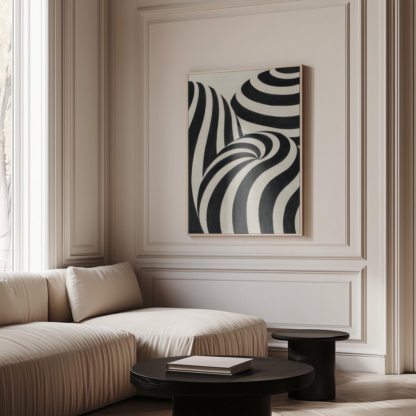 Swirling black and white striped forms, canvas print displayed on a neutral wall in a styled interior