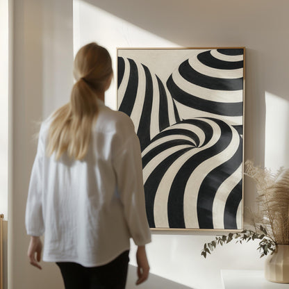 Swirling black and white striped forms, canvas wall art presented in a light, minimal room