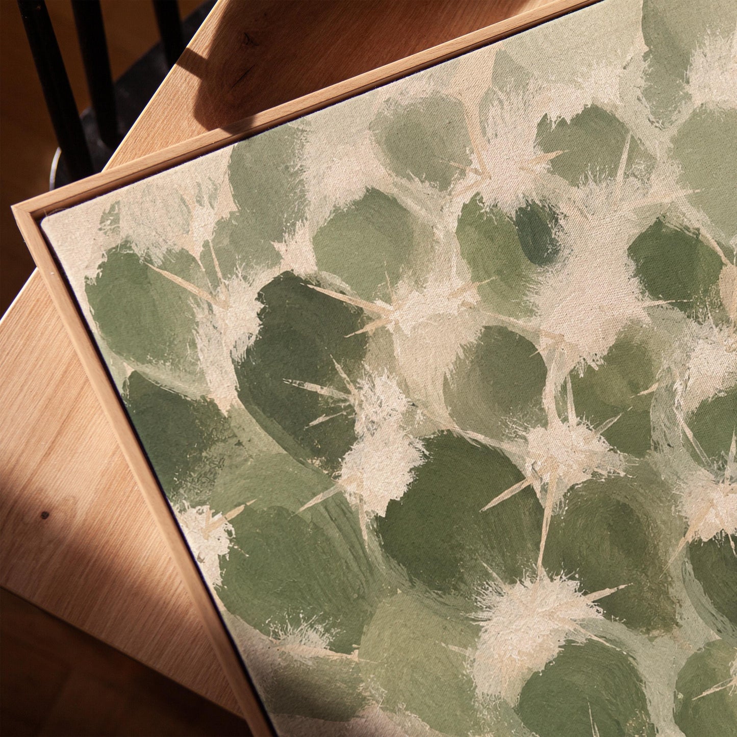 Cactus pads pattern with pale spines in sage green, canvas print in a warm, minimally styled interior