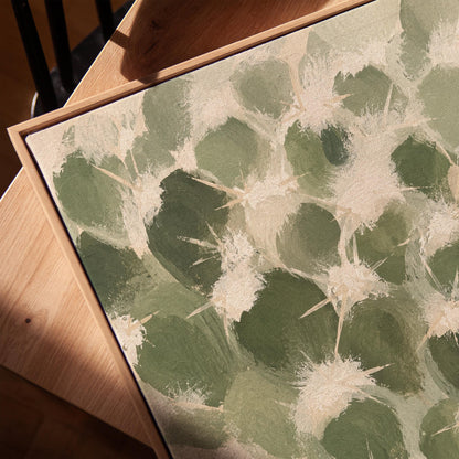 Cactus pads pattern with pale spines in sage green, canvas print in a warm, minimally styled interior