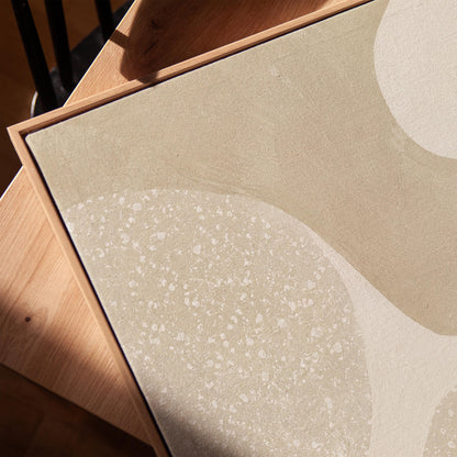 Soft speckled organic shapes in pearl and cream, canvas print in a warm, minimally styled interior