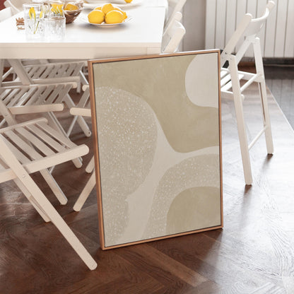 Soft speckled organic shapes in pearl and cream, canvas wall art presented in a light, minimal room