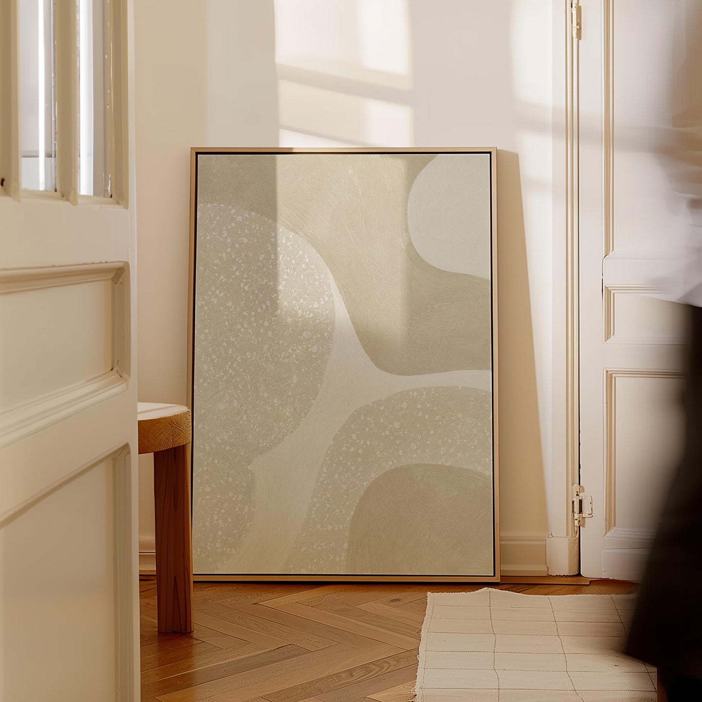 Soft speckled organic shapes in pearl and cream, canvas wall art on a quiet wall in a considered interior