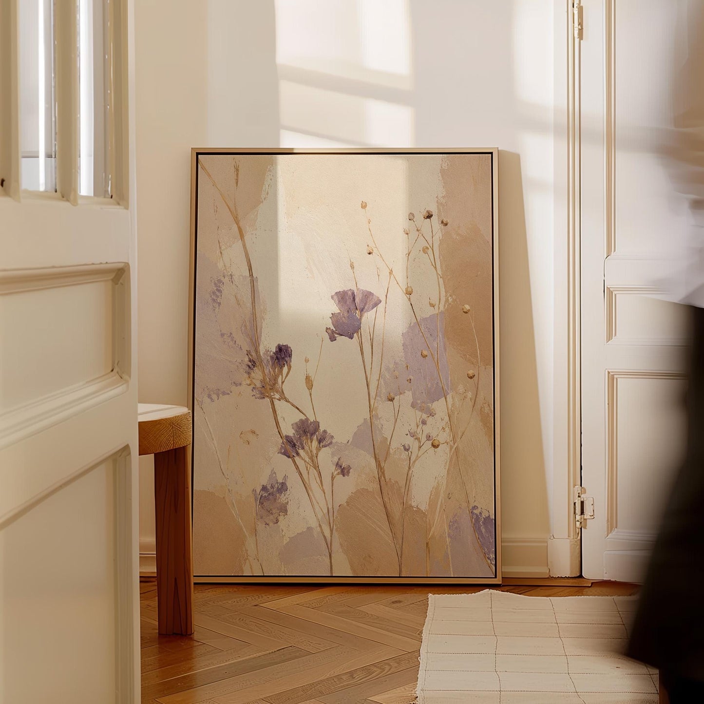 Delicate wildflowers and lavender stems on warm beige, canvas print presented in a light, minimal room