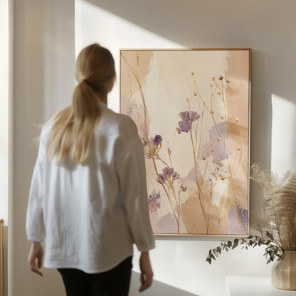 Delicate wildflowers and lavender stems on warm beige, canvas print displayed on a neutral wall in a styled interior