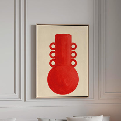 Bold red vessel with ring handles on cream background, canvas print in a bright room with natural daylight
