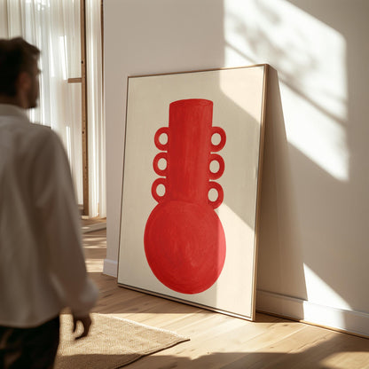 Bold red vessel with ring handles on cream background, canvas print shown in a sunlit, contemporary room