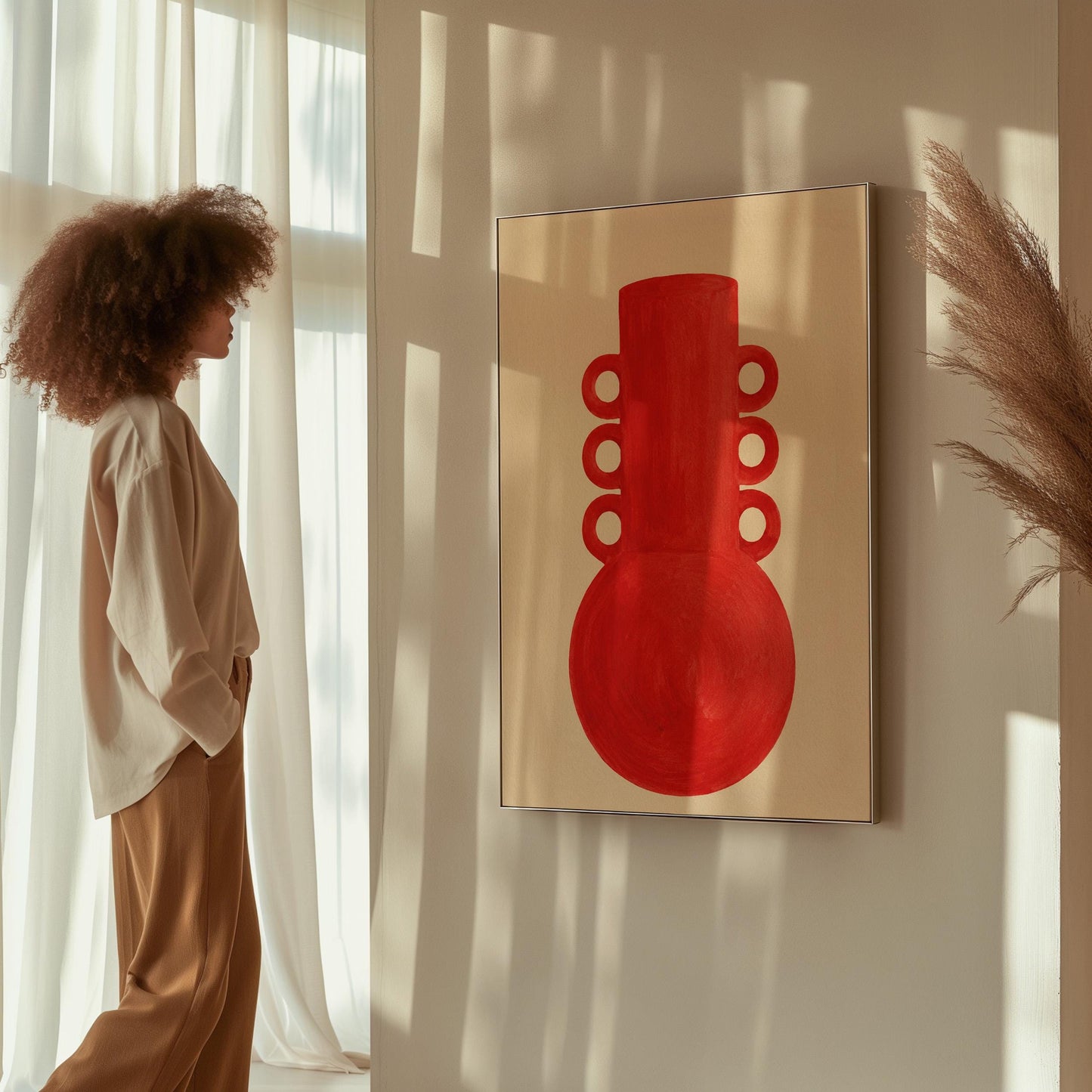 Bold red vessel with ring handles on cream background, canvas wall art hanging in a calm, modern living space