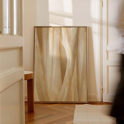 Golden beige ribbon strands flowing diagonally, canvas wall art hanging in a calm, modern living space