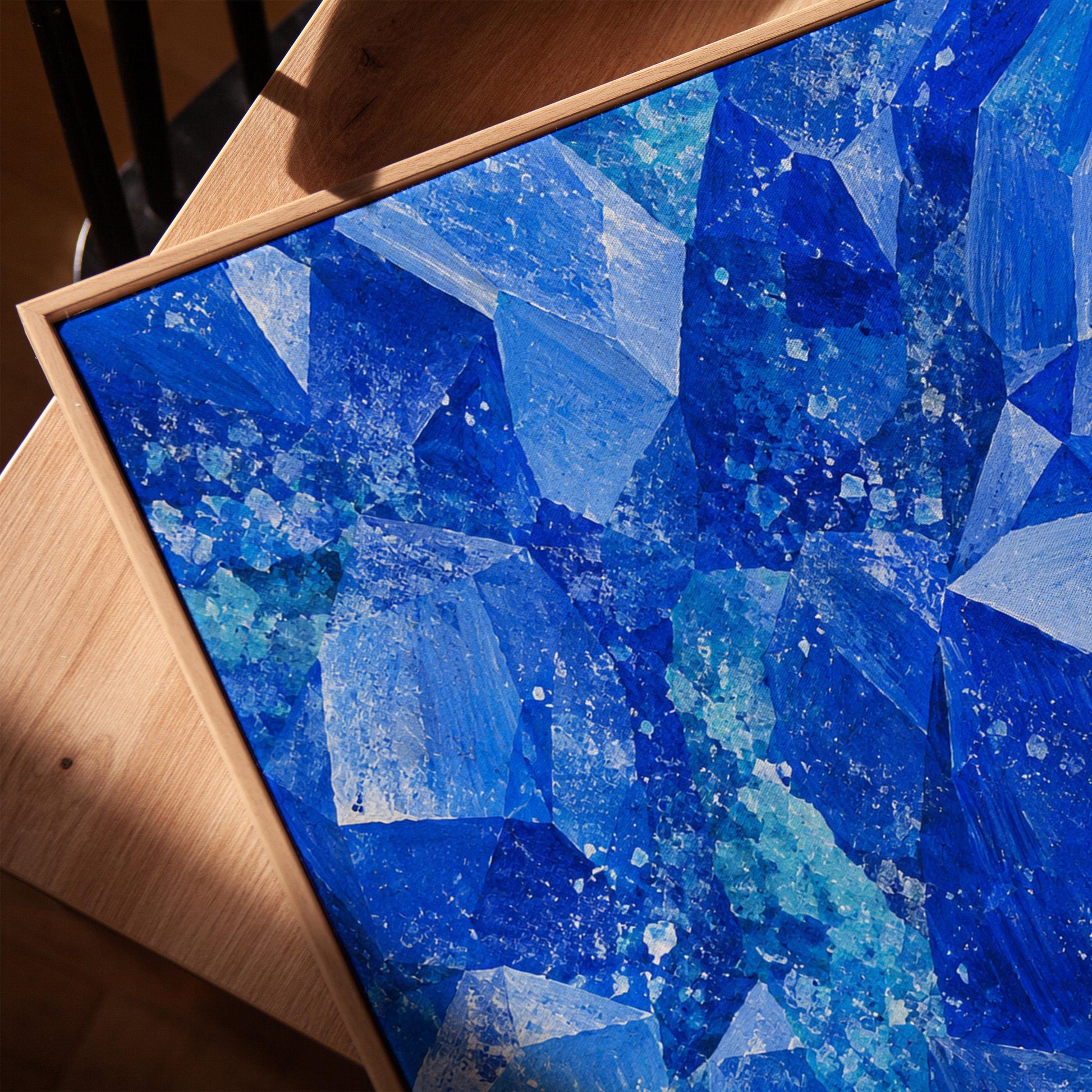 Faceted sapphire crystal planes with turquoise sparks, canvas print in a warm, minimally styled interior