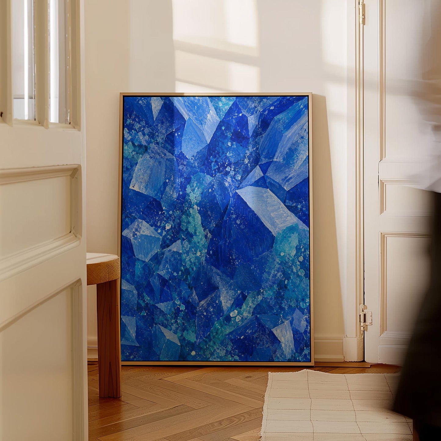 Faceted sapphire crystal planes with turquoise sparks, canvas print hanging in a calm, modern living space