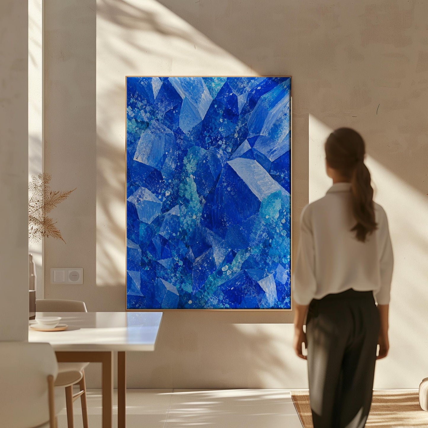 Faceted sapphire crystal planes with turquoise sparks, canvas wall art seen in a warm interior with natural light