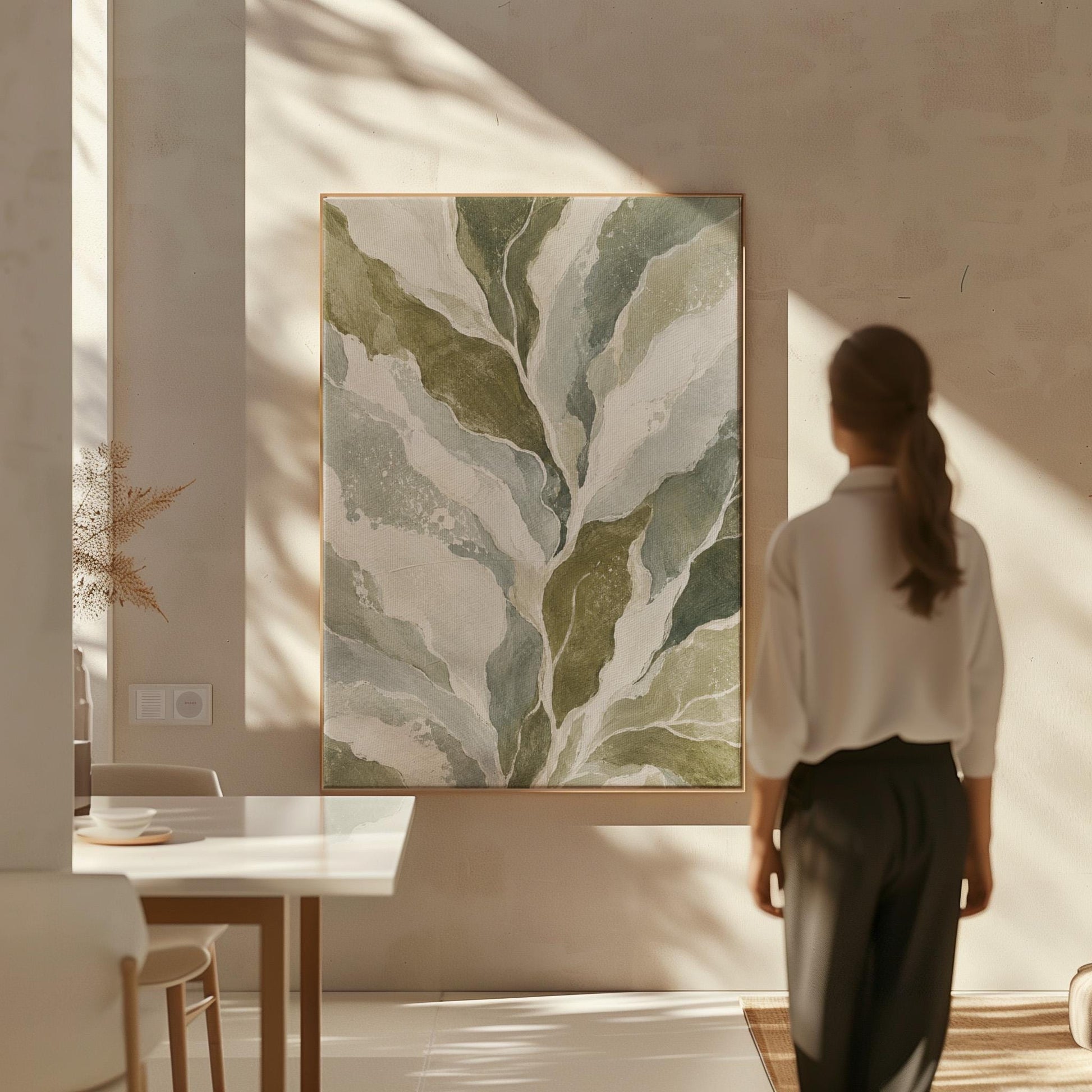 Flowing olive green leaves with soft marbled look, canvas print seen in a warm interior with natural light