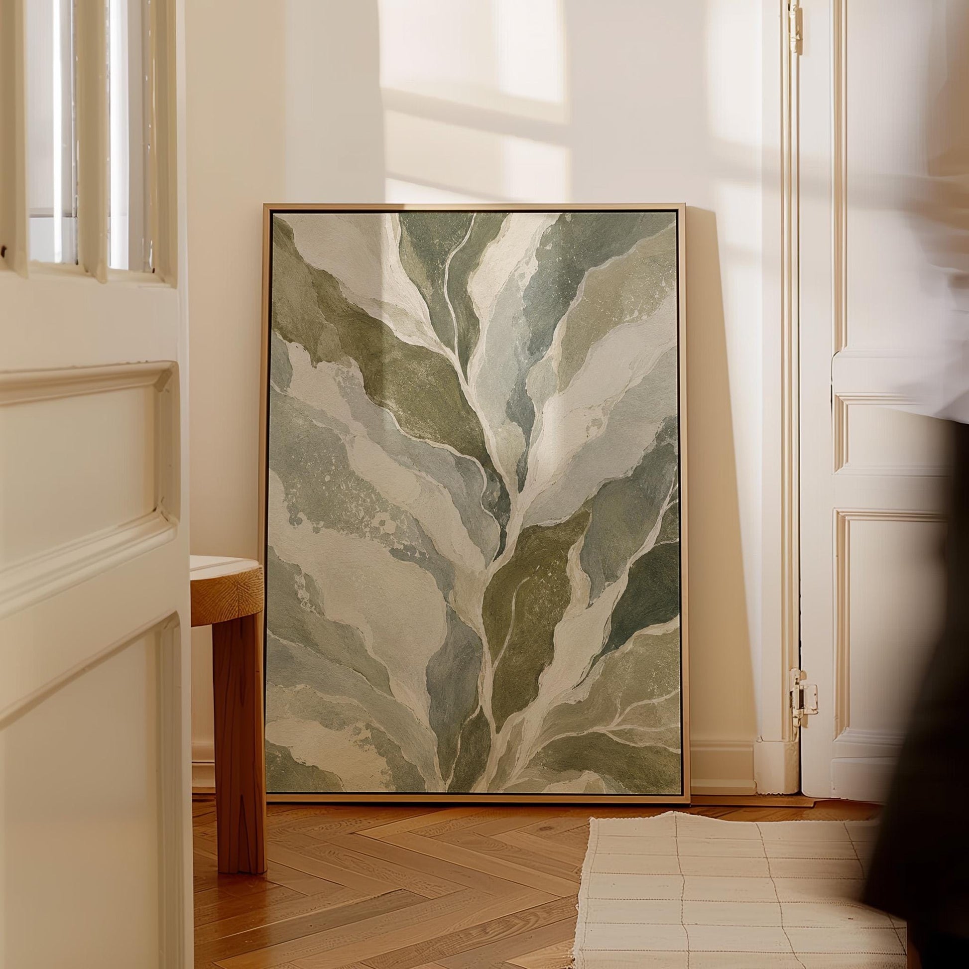 Flowing olive green leaves with soft marbled look, canvas wall art presented in a light, minimal room