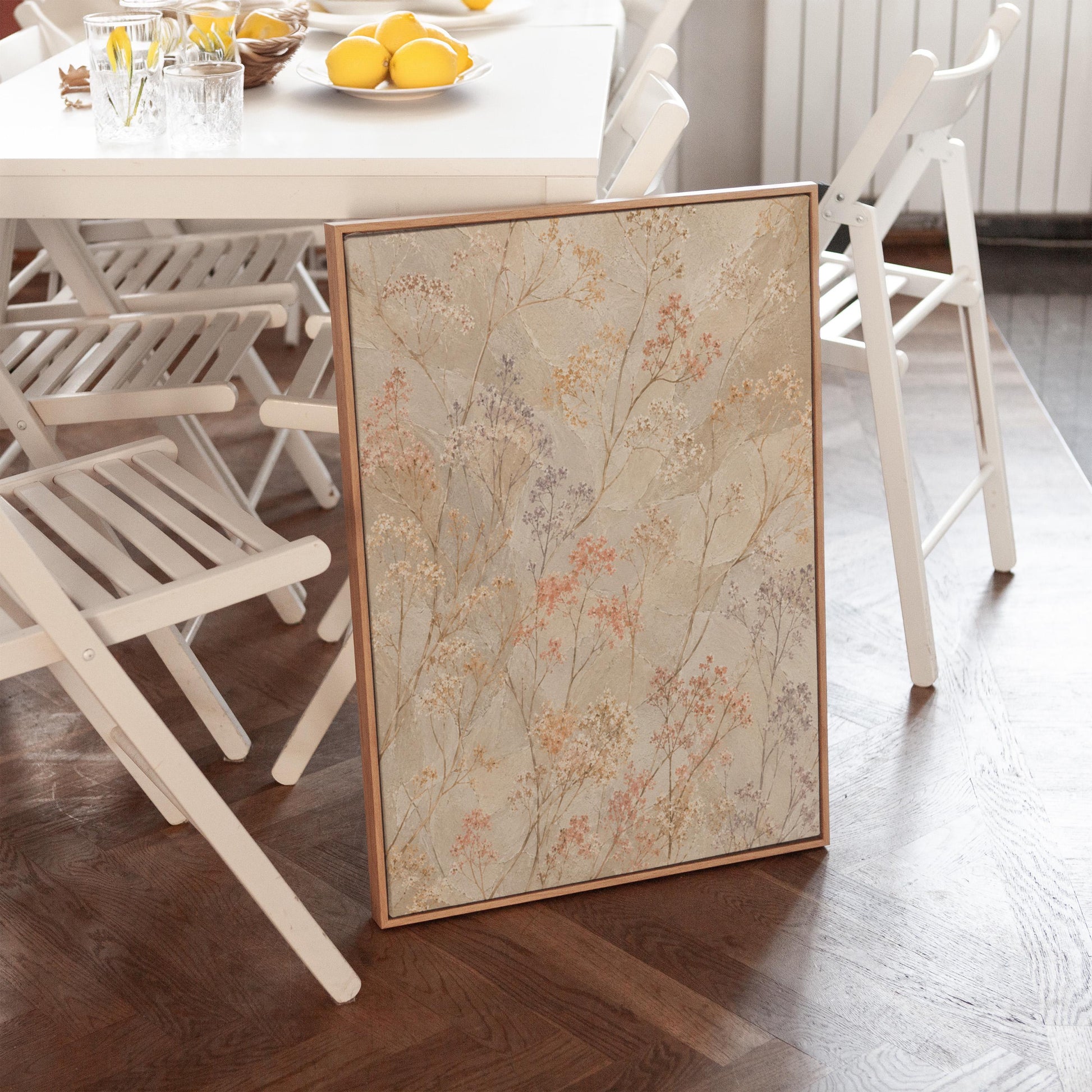 Fine sprigs and tiny blooms scattered on cream, canvas print hanging in a calm, modern living space