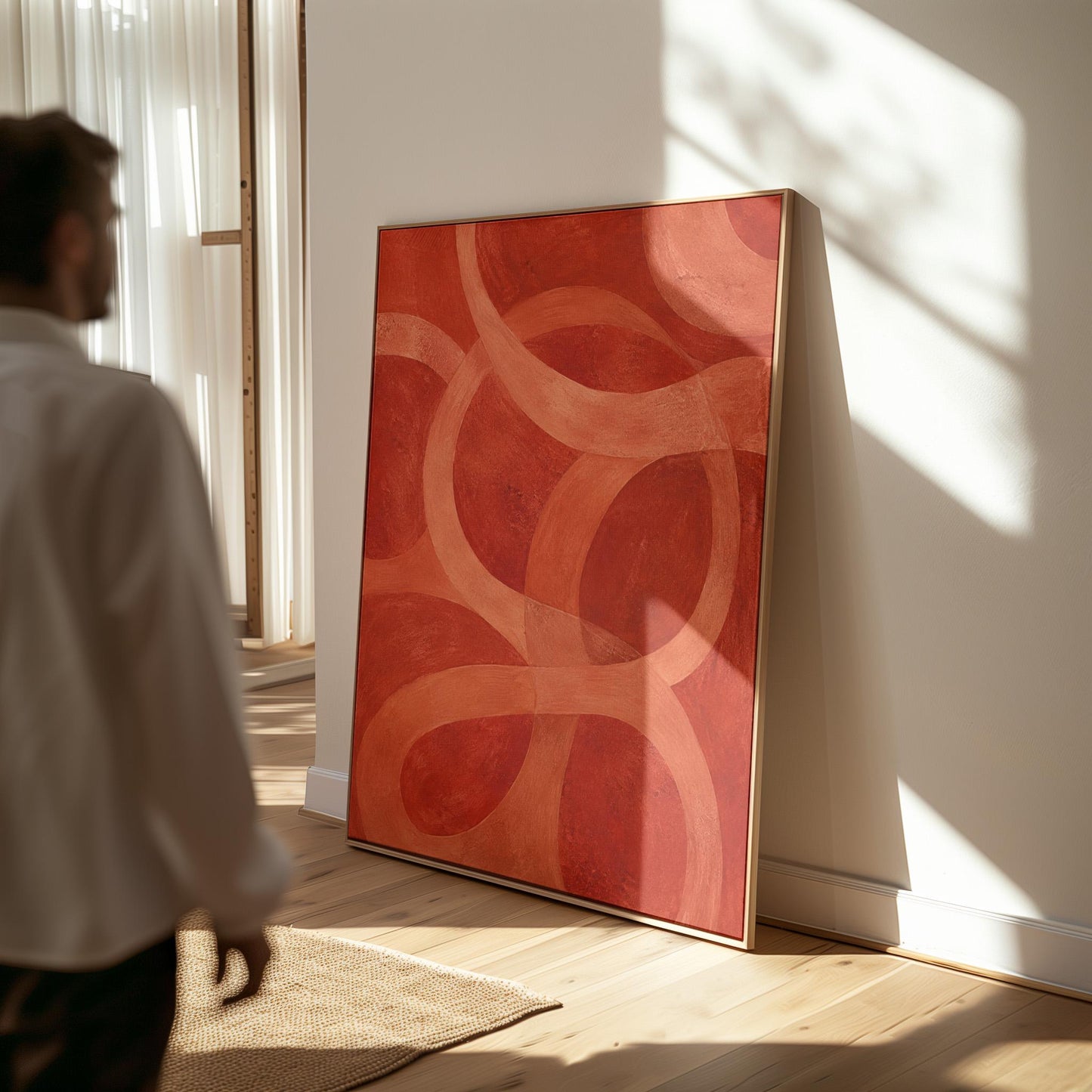 Interlocking loop rings in burnt orange and rust, canvas wall art seen in a warm interior with natural light