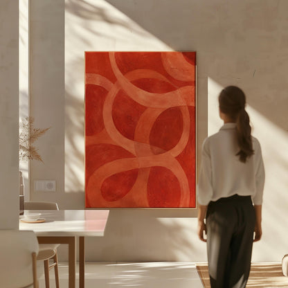 Interlocking loop rings in burnt orange and rust, canvas wall art presented in a light, minimal room